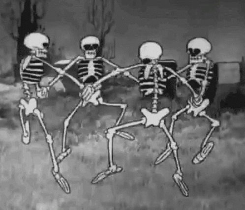 A gif of four animated skeletons dancing in a circle in a graveyard.